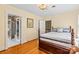 Bedroom boasts hardwood floors, patterned wallpaper visible through doorways, and a spacious feel at 1233 General Hoke Dr, Lincolnton, NC 28092