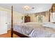 Bright bedroom showcasing hardwood floors, vintage furniture and a glimpse into an attached bathroom at 1233 General Hoke Dr, Lincolnton, NC 28092