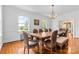 Traditional dining room featuring hardwood floors, white walls, and natural light from the large windows at 1233 General Hoke Dr, Lincolnton, NC 28092