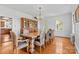 Bright dining room featuring hardwood floors, large windows, and a large hutch at 1233 General Hoke Dr, Lincolnton, NC 28092