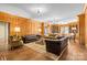 Expansive living room with wood-paneled walls, built-in bookshelves, and elegant furnishings at 1233 General Hoke Dr, Lincolnton, NC 28092