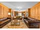 Elegant living room features wood paneling, built-in bookcases, and comfortable seating at 1233 General Hoke Dr, Lincolnton, NC 28092