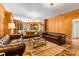 Elegant living room with wood paneling, built-in bookcases, and comfortable seating at 1233 General Hoke Dr, Lincolnton, NC 28092