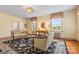 A cozy living room featuring a patterned rug, hardwood floors, and two windows providing natural light at 1233 General Hoke Dr, Lincolnton, NC 28092