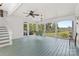 Spacious screened porch with green floors, white trim, and views of the backyard at 1233 General Hoke Dr, Lincolnton, NC 28092