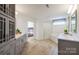 Modern bathroom with double vanity, walk-in shower, soaking tub, and gray cabinetry at 124 Fordham Ct # 19, Fort Mill, SC 29715