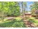 Large backyard with a trampoline, and a storage shed, offering plenty of space for outdoor activities at 1432 Deer Forest Dr, Fort Mill, SC 29707