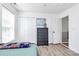 Well-lit bedroom featuring a double closet, dresser, and doorway with staircase at 1432 Deer Forest Dr, Fort Mill, SC 29707