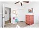 Bright bedroom with salmon colored dresser, closet, and access to stairs at 1432 Deer Forest Dr, Fort Mill, SC 29707