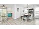 Open dining area with modern lighting, dining table, adjacent kitchen with colorful cabinets at 1432 Deer Forest Dr, Fort Mill, SC 29707