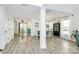 Open concept dining room and kitchen with gray floors, white walls and plenty of natural light at 1432 Deer Forest Dr, Fort Mill, SC 29707