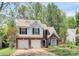 Two-story home with brick and siding exterior, attached garage, and mature trees at 1432 Deer Forest Dr, Fort Mill, SC 29707