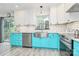 Bright kitchen features white and turquoise cabinets, stainless steel appliances, and a farmhouse sink with access to the backyard at 1432 Deer Forest Dr, Fort Mill, SC 29707