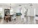 Bright living room with gray floors, a vaulted ceiling, an arched window, and an entry bench at 1432 Deer Forest Dr, Fort Mill, SC 29707