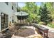 Brick patio with outdoor dining and planting beds at 1432 Deer Forest Dr, Fort Mill, SC 29707