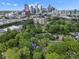 Beautiful aerial view of neighborhood with a cityscape and large green trees at 1514 S Rensselaer Pl, Charlotte, NC 28203
