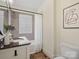 Well-lit bathroom featuring a granite countertop vanity, tiled shower, and neutral decor at 1514 S Rensselaer Pl, Charlotte, NC 28203