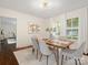 Elegant dining room with hardwood floors, natural light from the windows and modern decor at 1514 S Rensselaer Pl, Charlotte, NC 28203