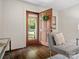 Inviting entryway with hardwood floors, decorative wreath, and a glimpse of the outdoors at 1514 S Rensselaer Pl, Charlotte, NC 28203