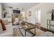 Inviting living room featuring a decorative fireplace, built-in shelves, and hardwood floors at 1514 S Rensselaer Pl, Charlotte, NC 28203
