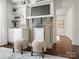 Charming living room with a decorative fireplace, built-in shelves, and hardwood floors at 1514 S Rensselaer Pl, Charlotte, NC 28203