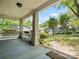 Charming porch with a swing, classic columns, and a view of the well-maintained front yard at 1514 S Rensselaer Pl, Charlotte, NC 28203