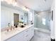Bathroom featuring double sinks, quartz countertop, gold fixtures, and a walk-in glass shower at 1525 Solitude Ct, Kannapolis, NC 28081