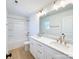Bathroom featuring dual sinks with gold faucets and a white vanity plus a bathtub with a shower at 1525 Solitude Ct, Kannapolis, NC 28081