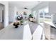 Open concept living space with a kitchen island, stainless steel appliances, and a living area with a sliding door at 1525 Solitude Ct, Kannapolis, NC 28081