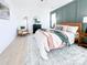 Bedroom with a bed, chair, wood floors, neutral decor, and two windows allowing natural light at 1525 Solitude Ct, Kannapolis, NC 28081