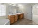 This bathroom features a soaking tub, double vanity, and tile flooring at 15814 Herring Gull Way, Charlotte, NC 28278