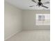 Bright bedroom with a ceiling fan and large window, offering ample natural light and a neutral color palette at 15814 Herring Gull Way, Charlotte, NC 28278