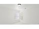 Bright, minimalist bedroom with white walls, carpet, two windows, and neutral shades for a modern, spacious feel at 15814 Herring Gull Way, Charlotte, NC 28278