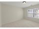 Cozy bedroom with neutral walls and natural light from large window at 15814 Herring Gull Way, Charlotte, NC 28278