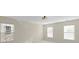Bright and airy bedroom with neutral walls and multiple windows offering lots of natural light, ready for personalization at 15814 Herring Gull Way, Charlotte, NC 28278