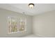 Bedroom with natural light from window overlooking wooded area at 15814 Herring Gull Way, Charlotte, NC 28278