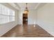 Dining room features wainscoting and a hanging light fixture over an open space at 15814 Herring Gull Way, Charlotte, NC 28278