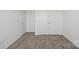 Bedroom features neutral carpet and double doors at 15910 Parkside Crossing Dr # 318, Charlotte, NC 28278