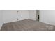 Bedroom features neutral carpet and white walls, providing a bright and airy feel at 15910 Parkside Crossing Dr # 318, Charlotte, NC 28278