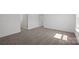 Bedroom with neutral carpet, white walls, and natural light from a large window at 15910 Parkside Crossing Dr # 318, Charlotte, NC 28278