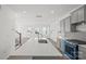 Spacious kitchen features a large island, stainless steel appliances, and sleek countertops at 15910 Parkside Crossing Dr # 318, Charlotte, NC 28278