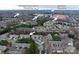 An aerial view shows the location of this neighborhood in relation to shopping and schools at 16631 Commons Creek Dr, Charlotte, NC 28277