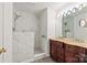 Elegant bathroom features a marble shower and a double sink vanity with a marble countertop at 16631 Commons Creek Dr, Charlotte, NC 28277