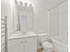 Bright bathroom featuring a white vanity and fixtures, a modern heated towel rack, and bathtub at 16631 Commons Creek Dr, Charlotte, NC 28277