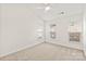 Bright bedroom featuring neutral carpet, three windows, and white walls at 16631 Commons Creek Dr, Charlotte, NC 28277