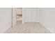 Bedroom featuring neutral carpet, and closet with double doors at 16631 Commons Creek Dr, Charlotte, NC 28277