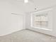 Bright bedroom featuring neutral carpet, a large closet, and a window seat at 16631 Commons Creek Dr, Charlotte, NC 28277