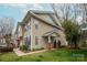 Attractive townhouse features a well-kept lawn, light-colored siding and dark shutters, adding to its visual appeal at 16631 Commons Creek Dr, Charlotte, NC 28277