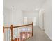 Upstairs hallway with modern lighting, neutral carpet, white railings and easy access to bedrooms at 16631 Commons Creek Dr, Charlotte, NC 28277
