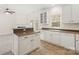 Well-equipped kitchen with white cabinets, stainless steel appliances, and a functional island at 16631 Commons Creek Dr, Charlotte, NC 28277